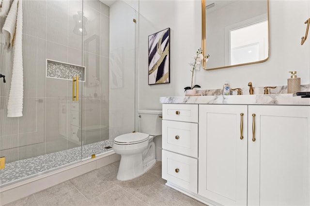 full bath featuring toilet, a stall shower, tile patterned floors, and vanity