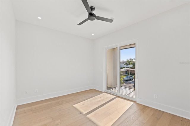 empty room with recessed lighting, baseboards, and wood finished floors