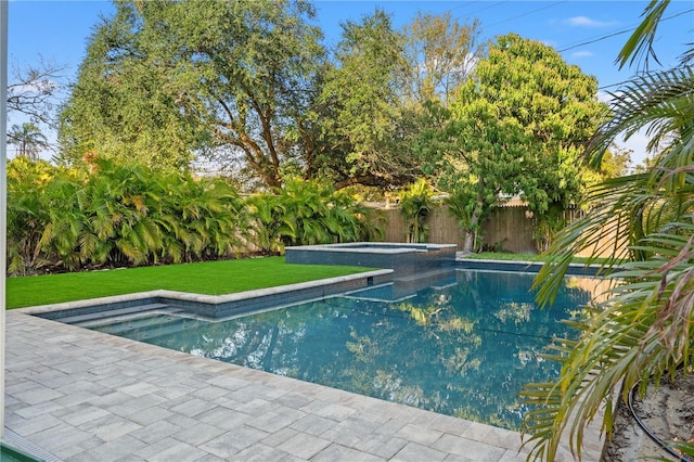 view of pool featuring a fenced in pool, a fenced backyard, a yard, and an in ground hot tub