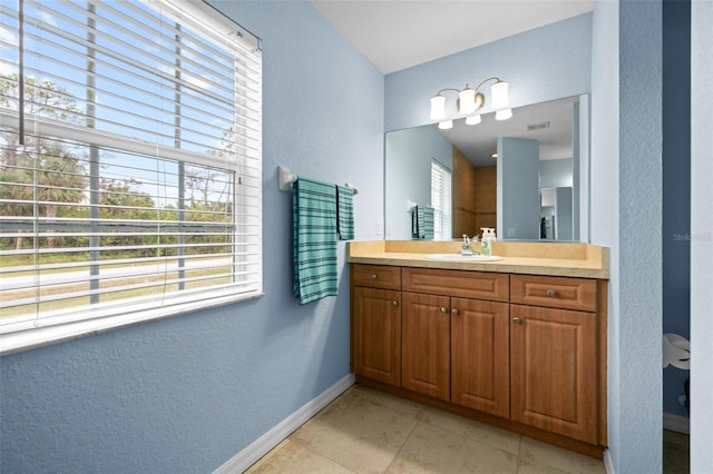 bathroom with vanity and tile patterned floors