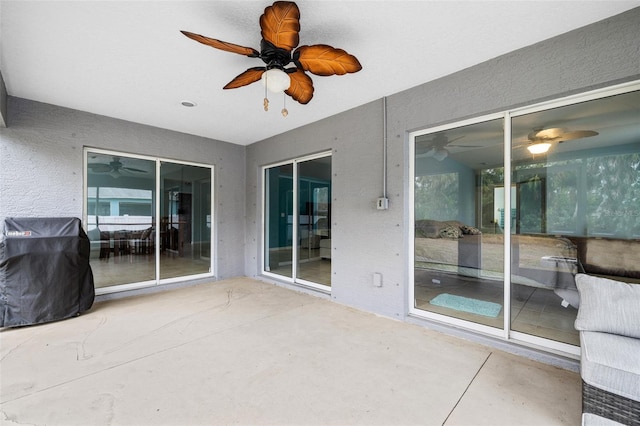 view of patio / terrace featuring ceiling fan and grilling area