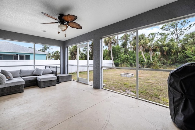 sunroom / solarium with ceiling fan