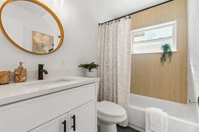 full bathroom featuring vanity, shower / bath combination with curtain, and toilet