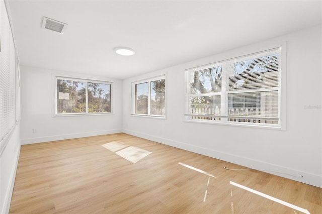 empty room featuring wood-type flooring