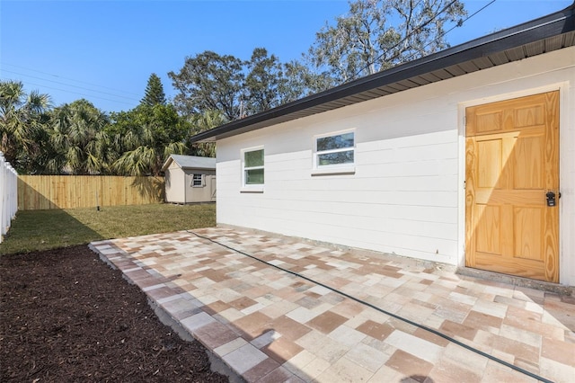 view of patio / terrace with a shed