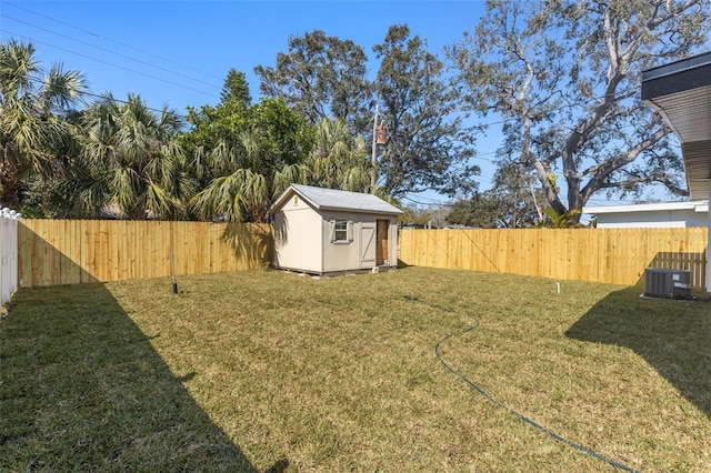 view of yard with cooling unit and a storage unit