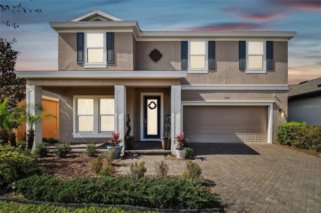 view of front of property with a garage