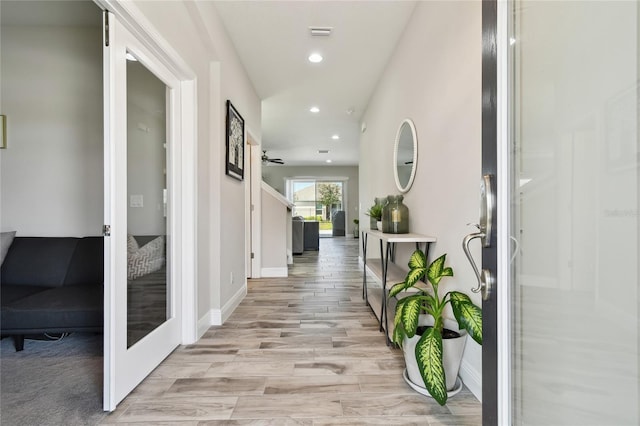 hall with light wood-type flooring