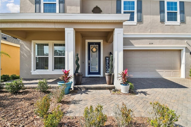 doorway to property with a garage