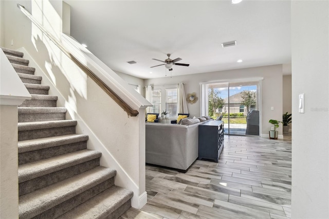 living room featuring ceiling fan