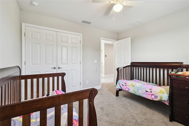 bedroom with carpet floors, a closet, and ceiling fan