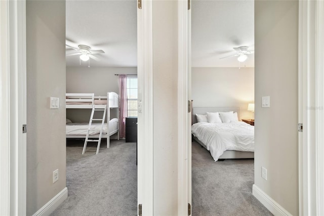 bedroom with light colored carpet and ceiling fan