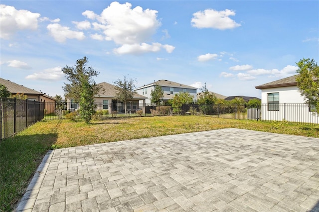 exterior space featuring a lawn and a patio area