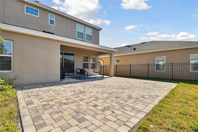 back of property with a patio area