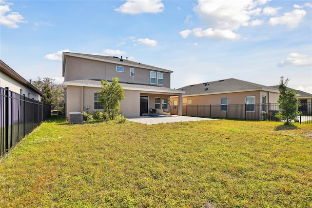 back of property featuring cooling unit, a patio area, and a lawn