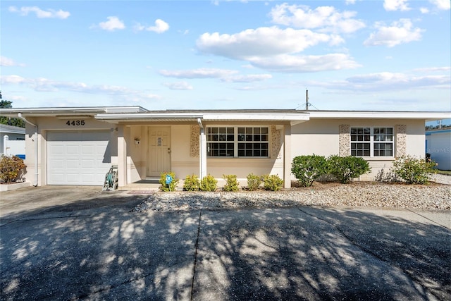 ranch-style home with a garage