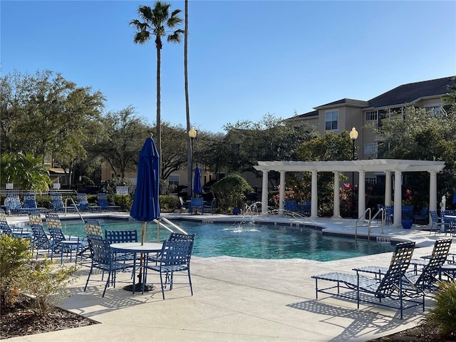 view of swimming pool with a pergola and a patio area