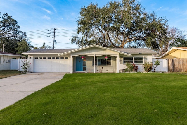 ranch-style home with a garage and a front yard