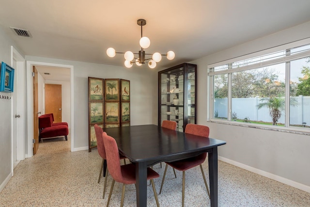 dining area featuring a chandelier