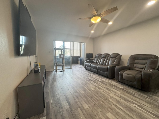 living room with hardwood / wood-style floors and ceiling fan