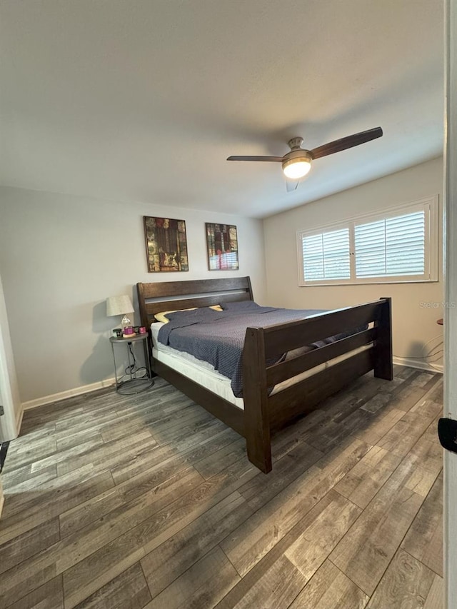 bedroom with wood-type flooring, billiards, and ceiling fan