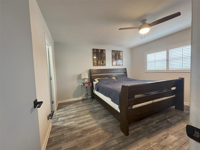 bedroom with ceiling fan and dark hardwood / wood-style flooring