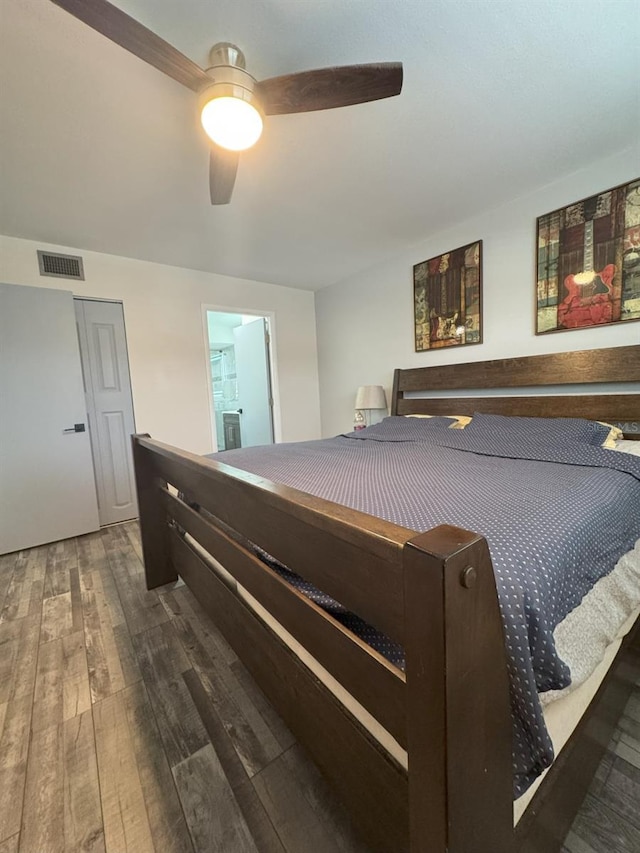 bedroom with dark wood-type flooring and ceiling fan