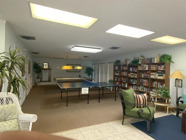 recreation room featuring light tile patterned flooring