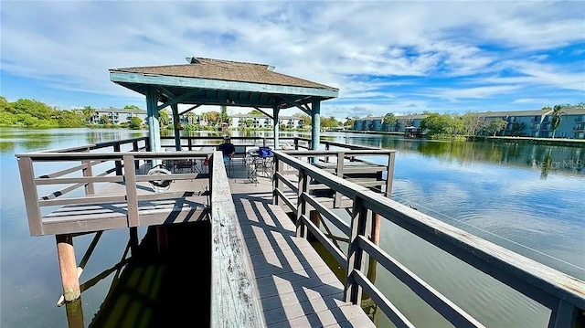 dock area with a gazebo and a water view