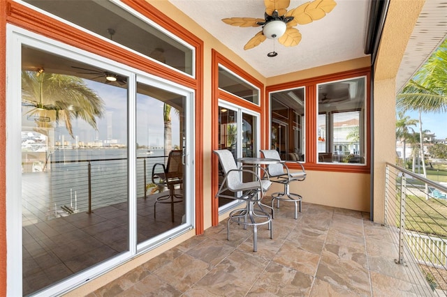 exterior space with ceiling fan and a wealth of natural light