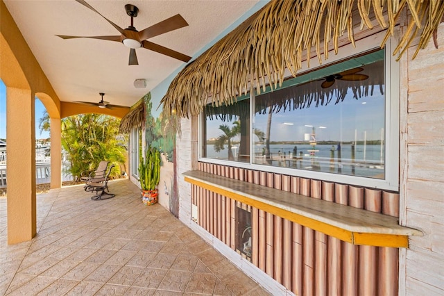 view of patio with a water view