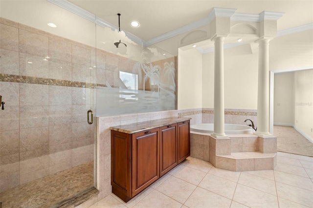 bathroom featuring tile patterned floors, ornamental molding, shower with separate bathtub, and ornate columns