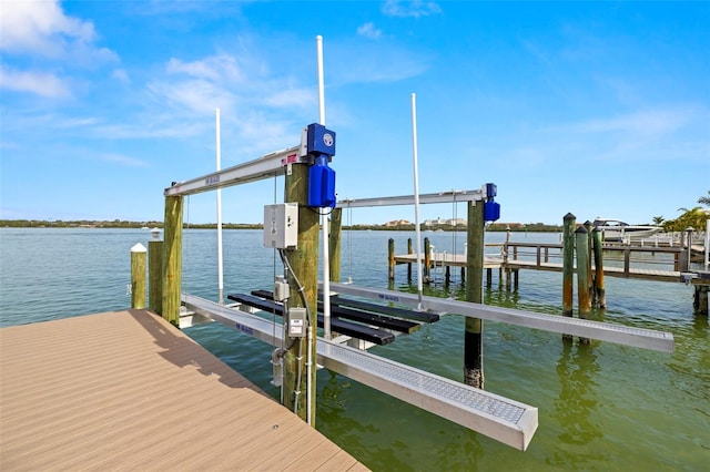 dock area with a water view