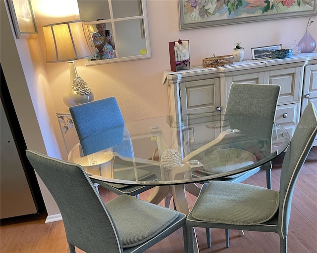 dining area with light hardwood / wood-style flooring