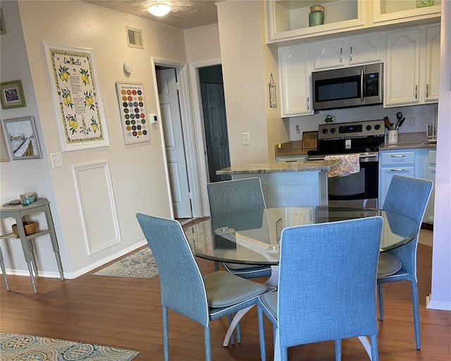 dining area featuring light hardwood / wood-style floors