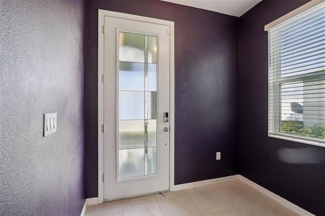 entryway featuring light tile patterned floors