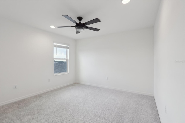 unfurnished room with ceiling fan and carpet flooring