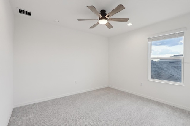 empty room featuring ceiling fan and carpet floors