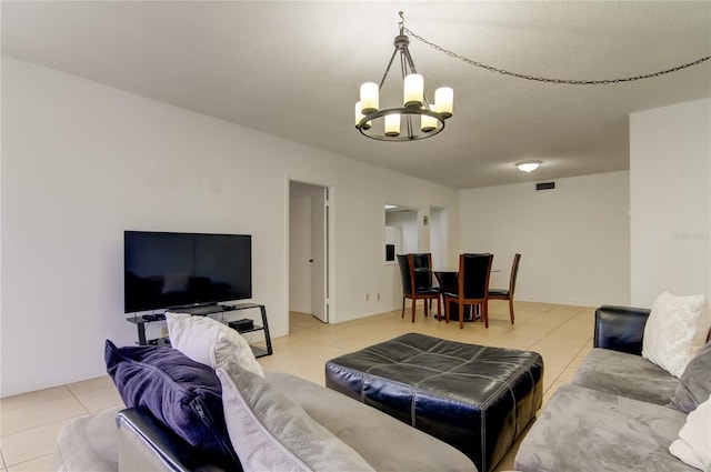 tiled living room with an inviting chandelier