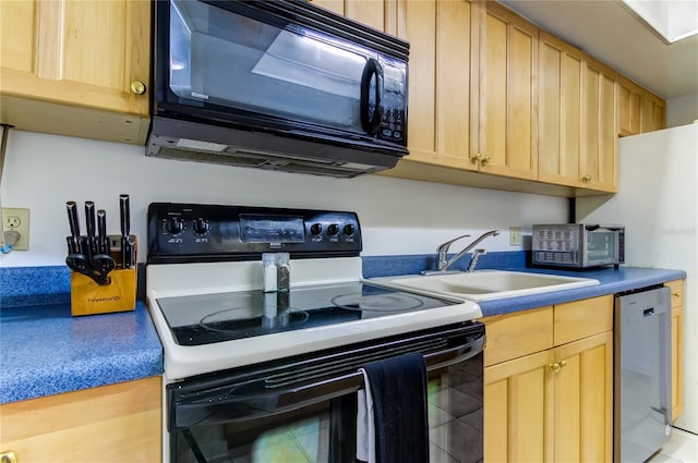 5396 Gulf Blvd Unit 110, St Pete Beach, FL 33706 - kitchen with range with electric cooktop, black microwave, dishwasher, a sink, and light brown cabinetry