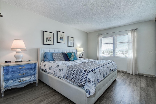 6400 46th Ave N Unit 307, Kenneth City, FL 33709 - bedroom with wood finished floors and a textured ceiling