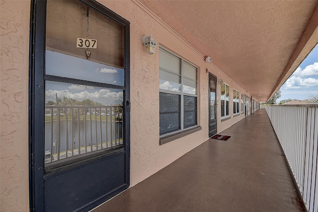 6400 46th Ave N Unit 307, Kenneth City, FL 33709 - view of patio with a water view