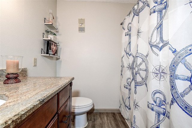 6400 46th Ave N Unit 307, Kenneth City, FL 33709 - full bathroom featuring wood finished floors, vanity, and a shower with curtain