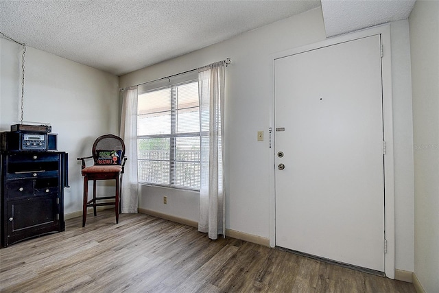 6400 46th Ave N Unit 307, Kenneth City, FL 33709 - office area featuring wood finished floors and a textured ceiling