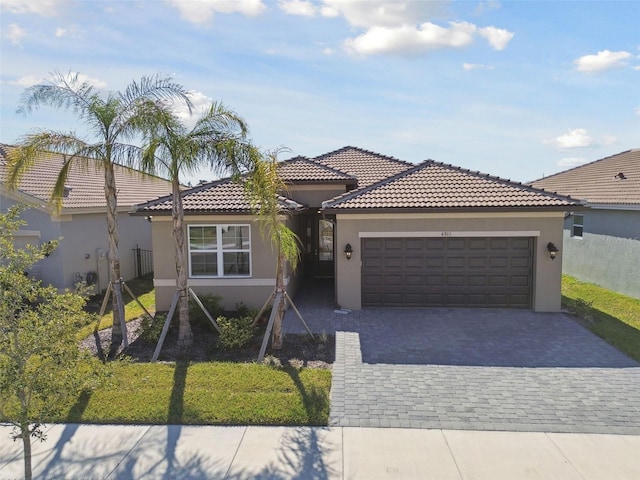 view of front of property with a garage