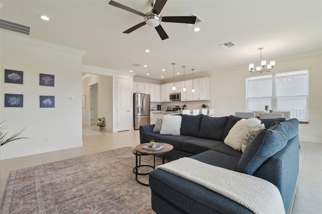 living room with crown molding, ceiling fan with notable chandelier, and light tile patterned floors