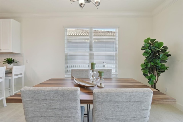 dining space with ornamental molding