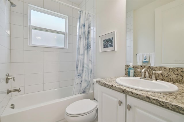 full bathroom with vanity, toilet, and shower / bath combo with shower curtain