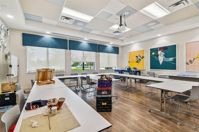 office featuring hardwood / wood-style floors and a paneled ceiling