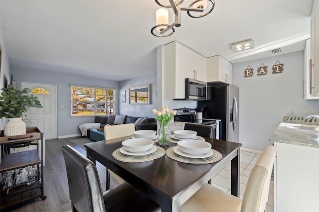 dining area with sink and dark hardwood / wood-style floors